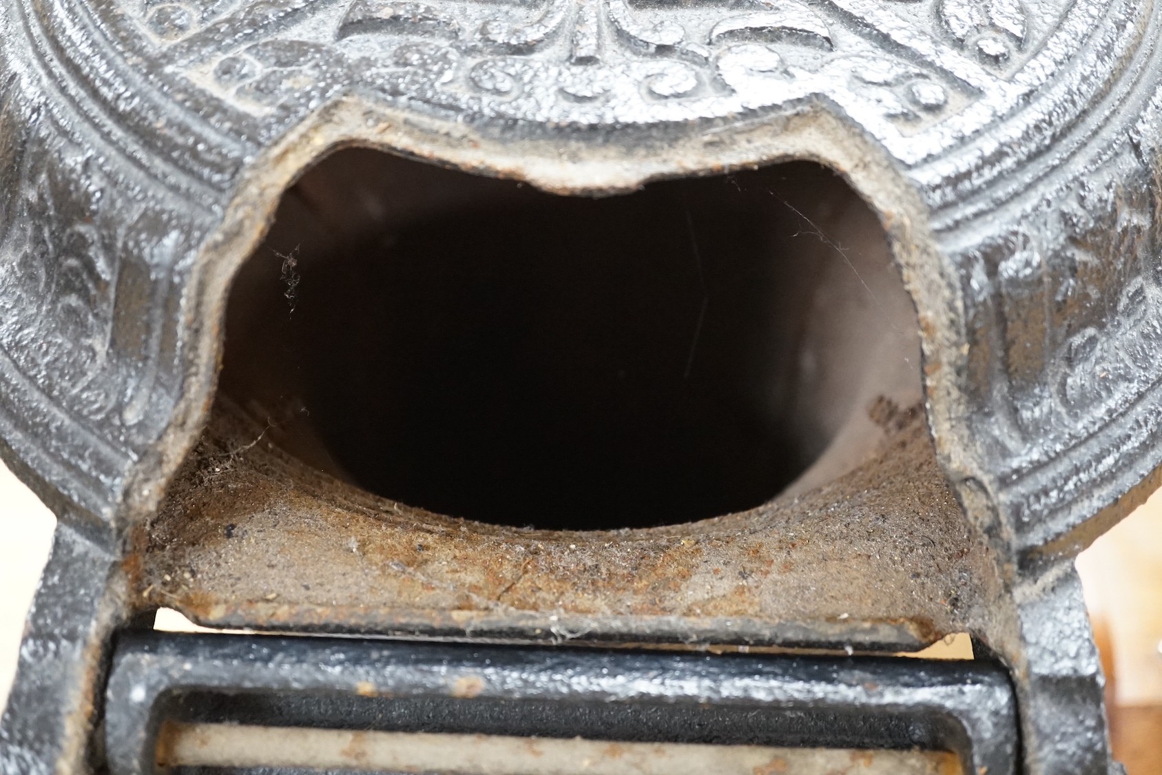 A black cast iron stove - 'The Slogan Stove’, 58cm high